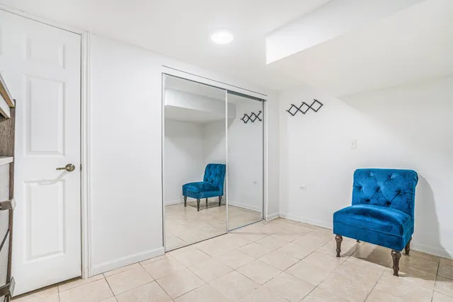 a view of room with furniture and wooden floor