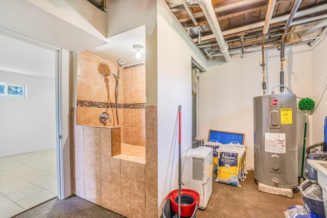 a view of storage and utility room with a window