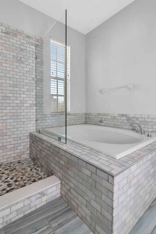 5313 Boardwalk Street Holiday, FL 34690 - Photo 33 of 69 a bathroom with a granite countertop bathtub and sink