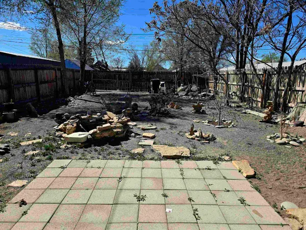 a view of a backyard of the house