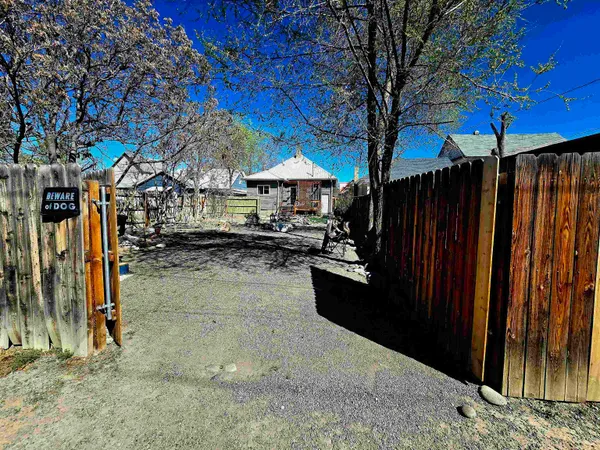 a view of a backyard with a patio