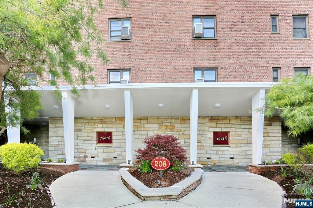 208 Anderson Street, Unit S4F Hackensack, NJ 07601 - Photo 13 of 20 a view of a patio with couches table and chairs and potted plants