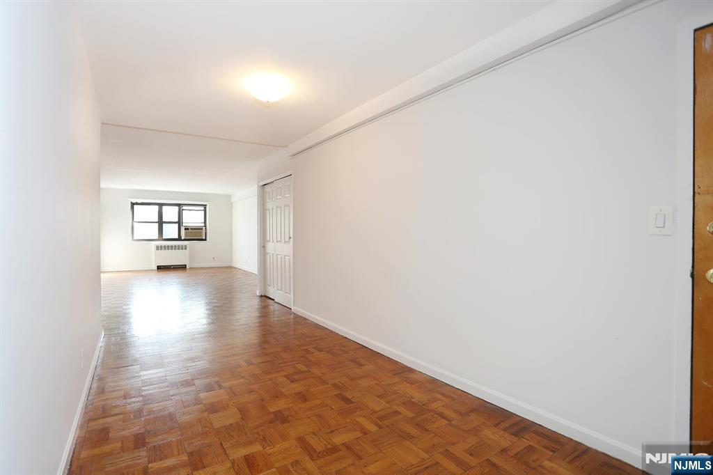 208 Anderson Street, Unit S4F Hackensack, NJ 07601 - Photo 5 of 20 a view of an empty room and window