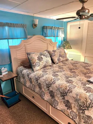 a bedroom with a bed and a dresser