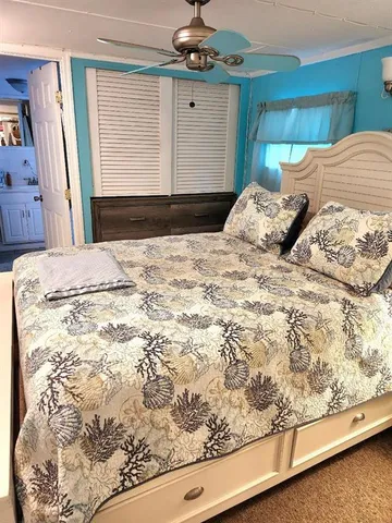 a bathroom with a double vanity sink toilet and shower