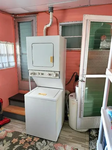 a view of a patio with table and chairs and potted plants