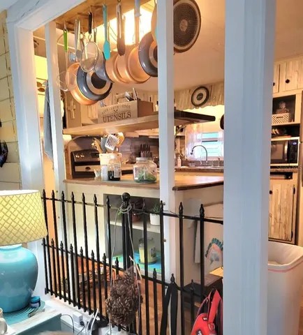 a view of a shop with door and stairs