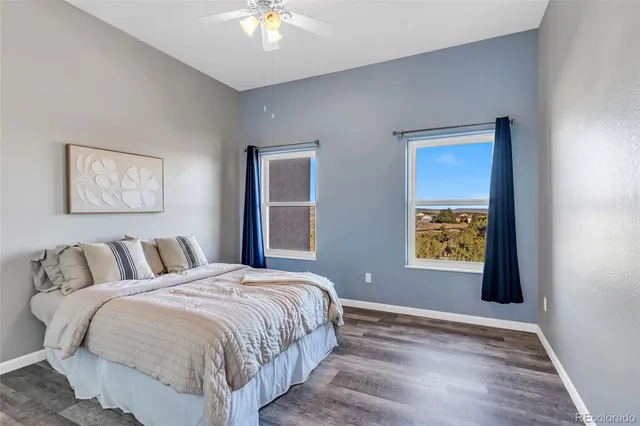 a spacious bedroom with a bed and a window