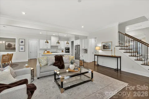 a living room with furniture and a table
