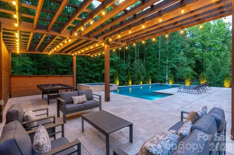 a backyard of a house with outdoor seating
