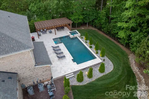 an aerial view of a house with outdoor space