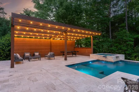 a view of a patio with chairs and table