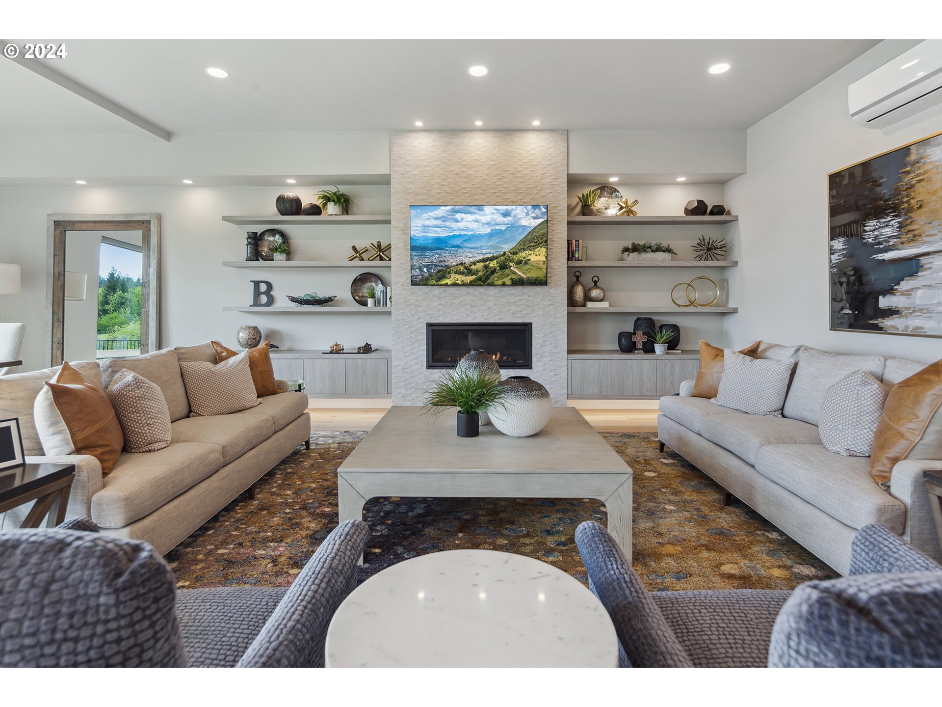 19915 Southeast Ascension Loop Camas, WA 98607 - Photo 11 of 42 a living room with furniture a fireplace and a flat screen tv