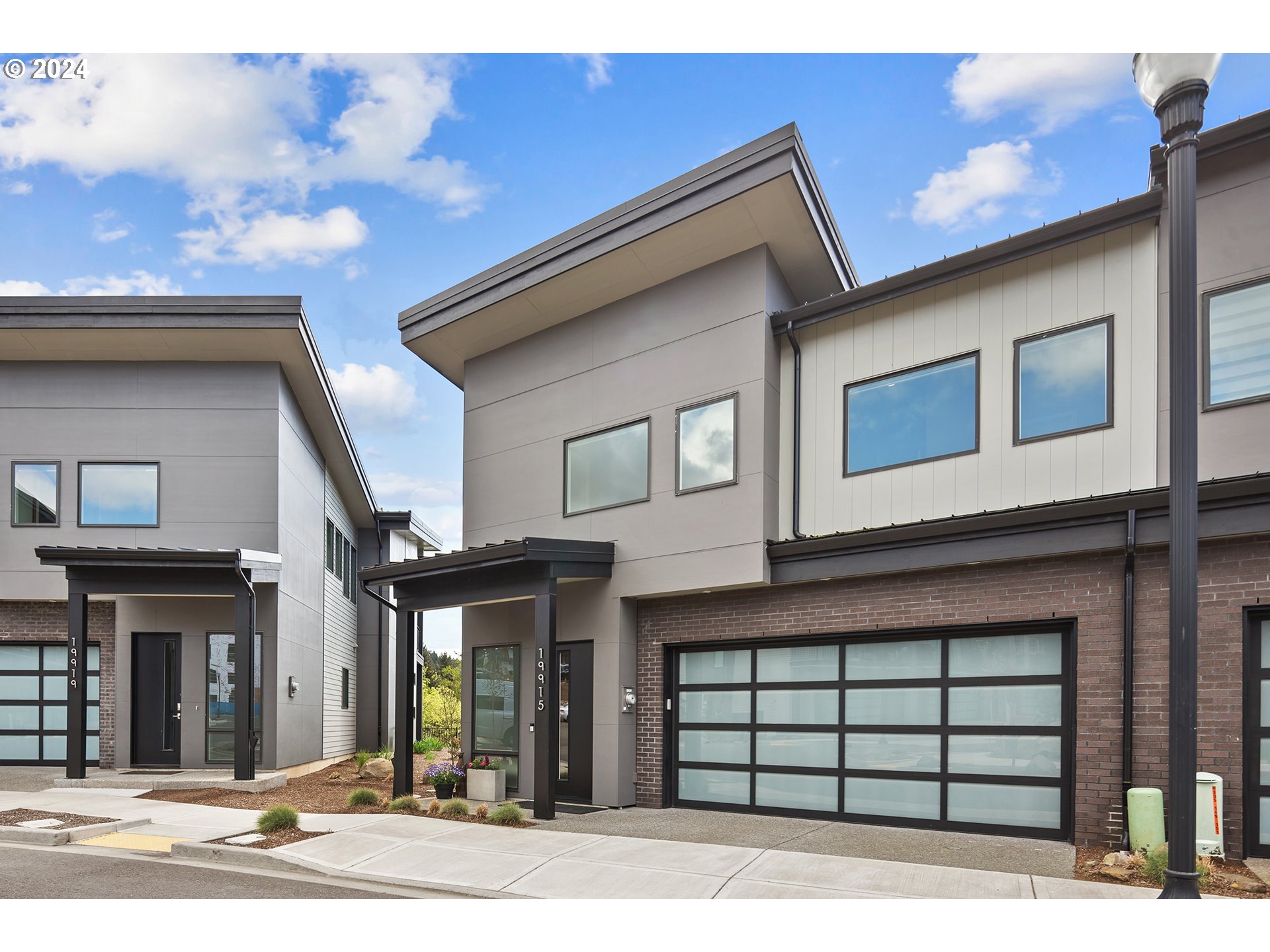 19915 Southeast Ascension Loop Camas, WA 98607 - Photo 2 of 42 a front view of a house with a garage