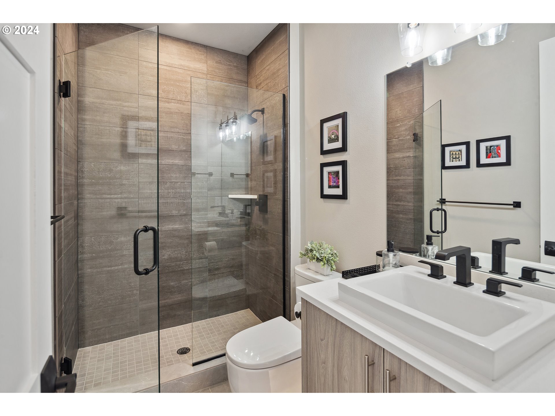 19915 Southeast Ascension Loop Camas, WA 98607 - Photo 22 of 42 a bathroom with a sink toilet and shower