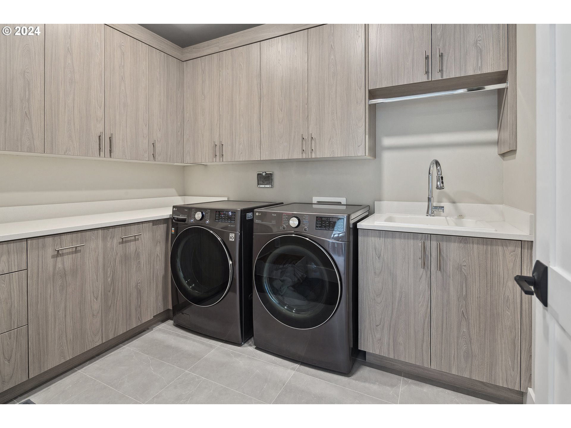 19915 Southeast Ascension Loop Camas, WA 98607 - Photo 23 of 42 a utility room with sink dryer and washer