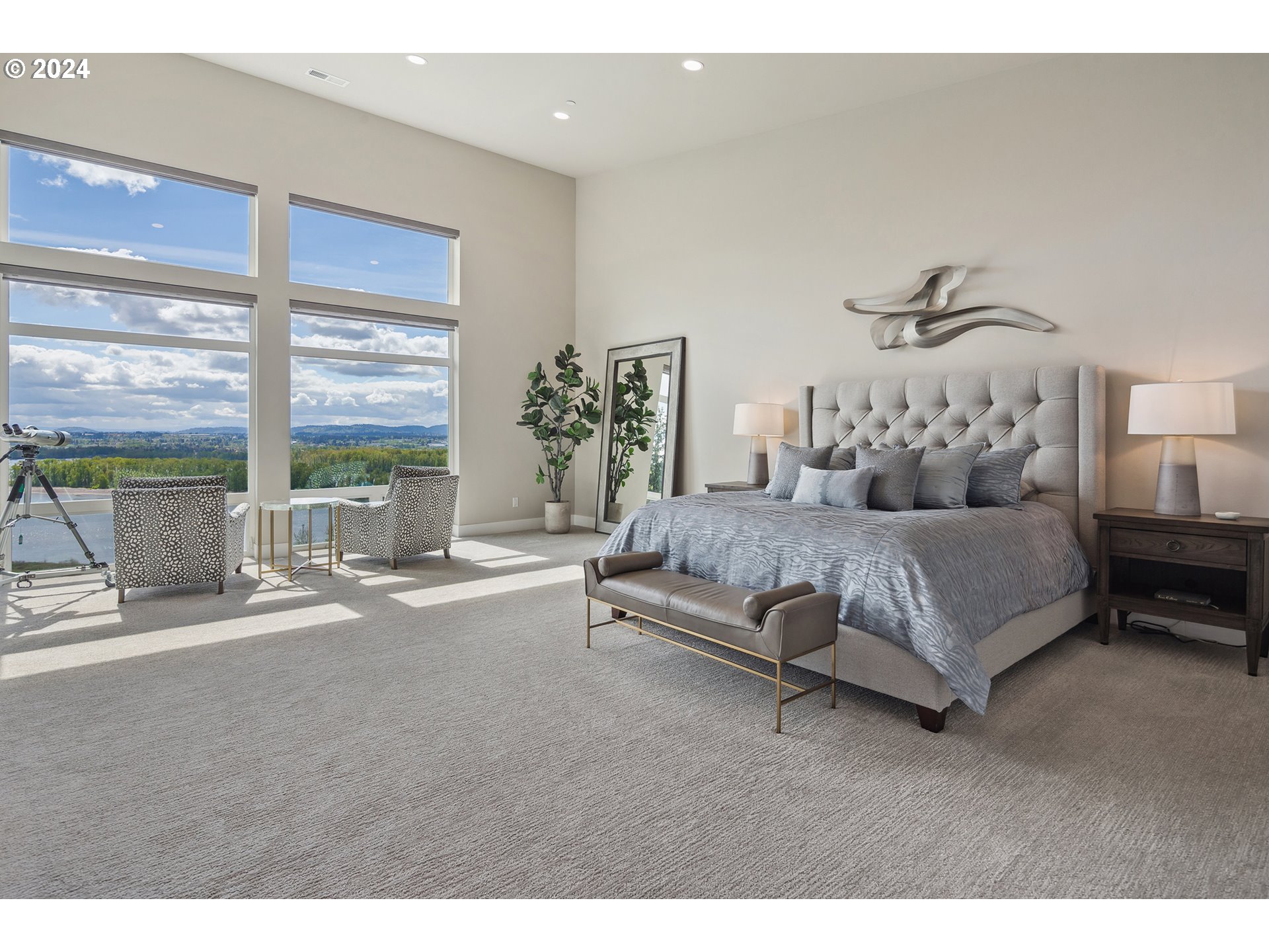 19915 Southeast Ascension Loop Camas, WA 98607 - Photo 24 of 42 a spacious bedroom with a bed a couch and large window