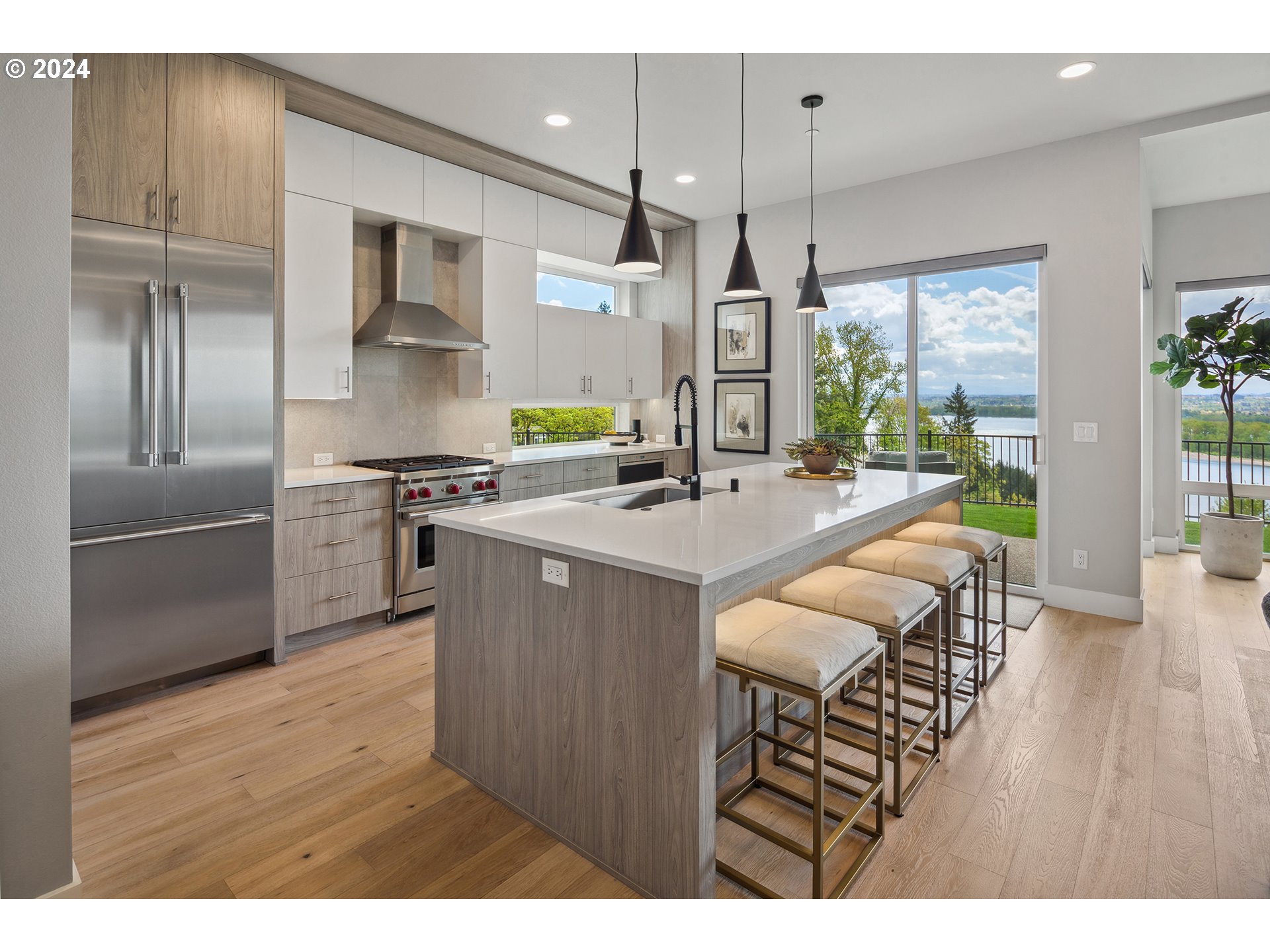 19915 Southeast Ascension Loop Camas, WA 98607 - Photo 4 of 42 a kitchen with kitchen island a counter space a sink appliances and cabinets