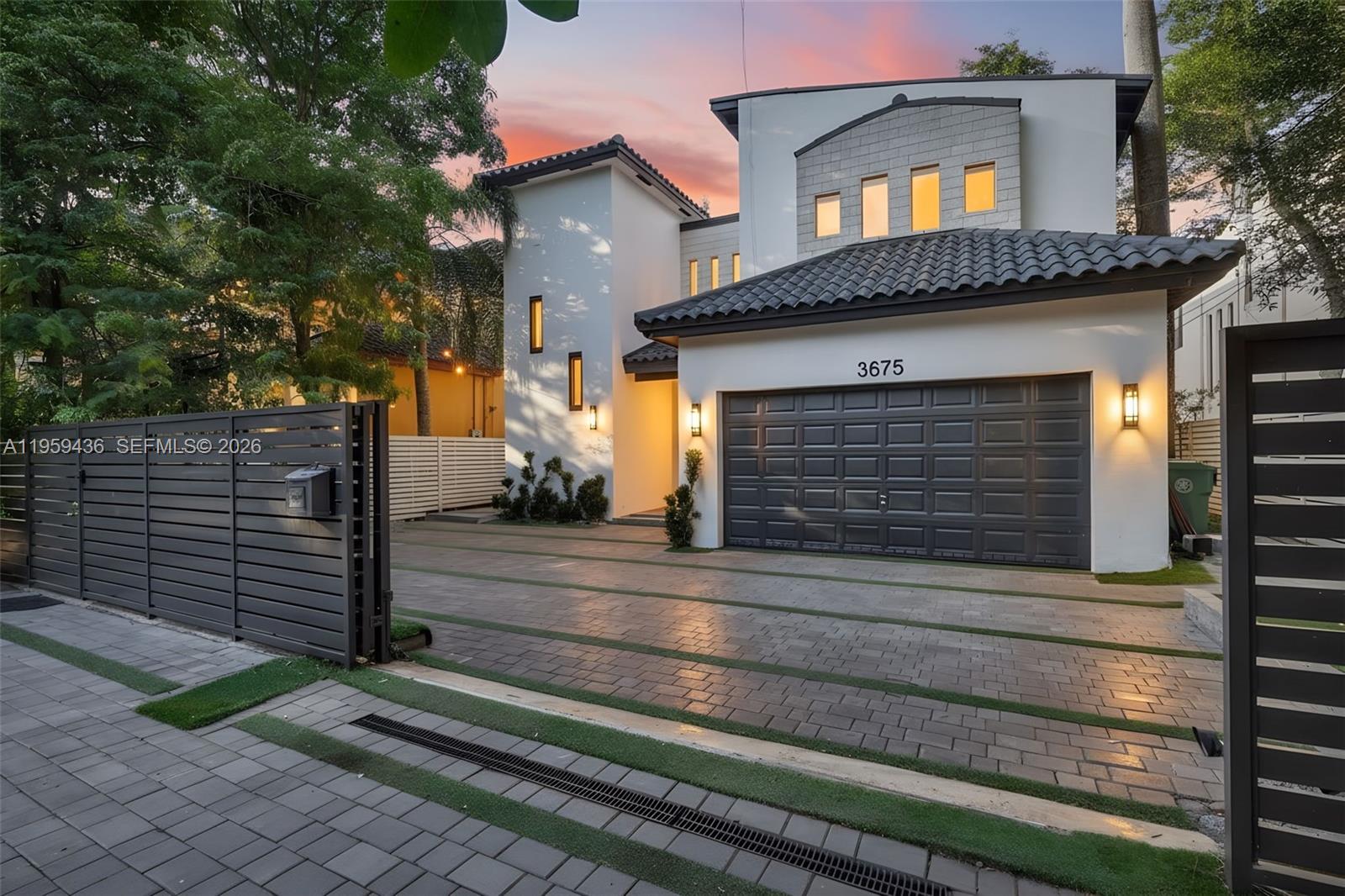 3675 Loquat Avenue Miami, FL 33133 - Photo 1 of 65 a front view of a house