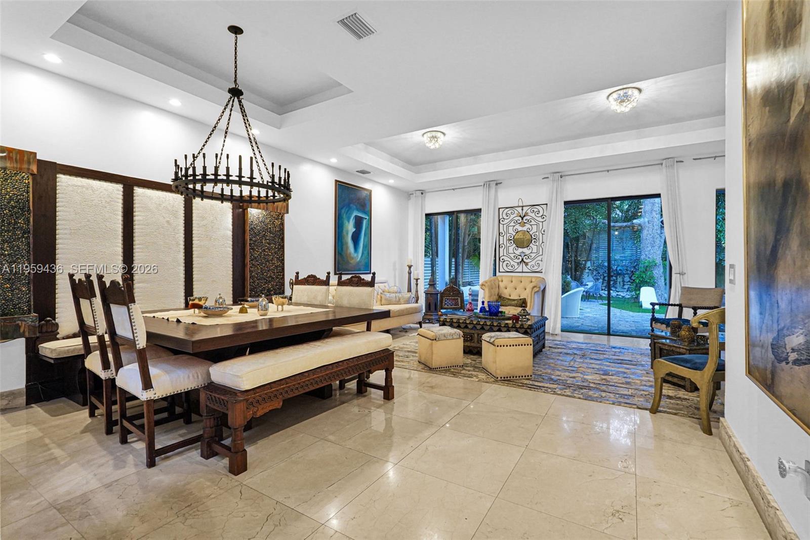 3675 Loquat Avenue Miami, FL 33133 - Photo 30 of 65 a living room with furniture and a large window