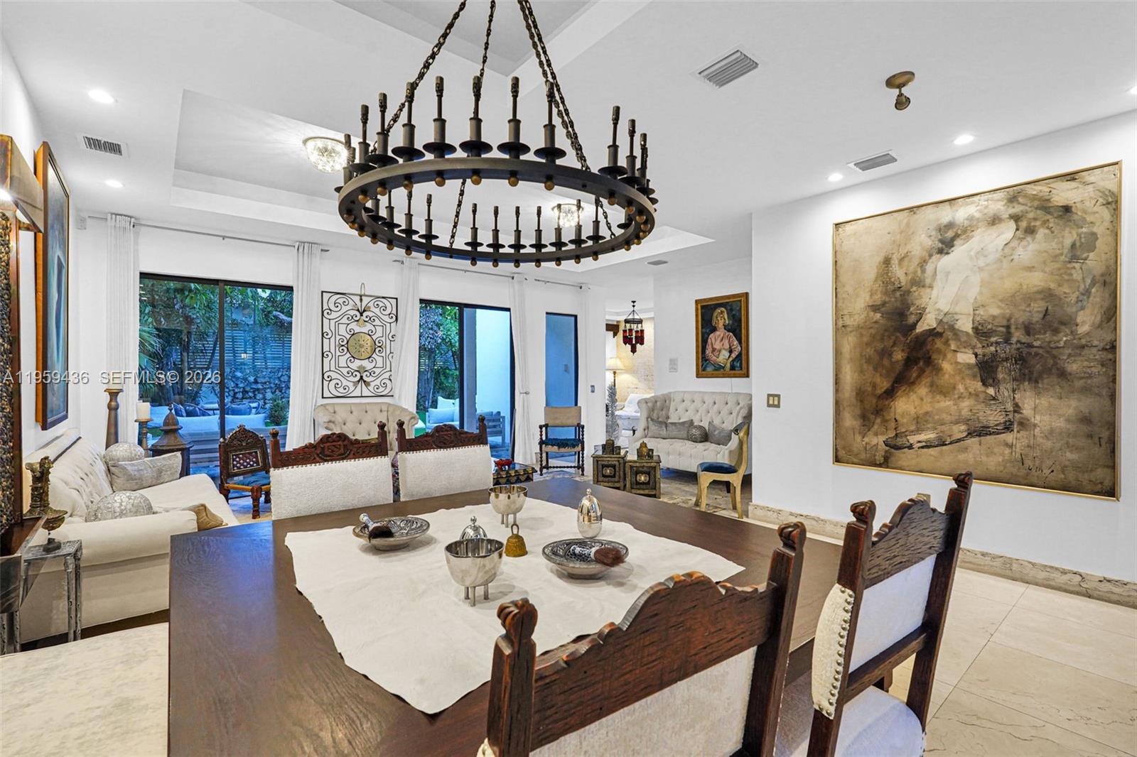 3675 Loquat Avenue Miami, FL 33133 - Photo 31 of 65 a view of a dining room with furniture window and outside view