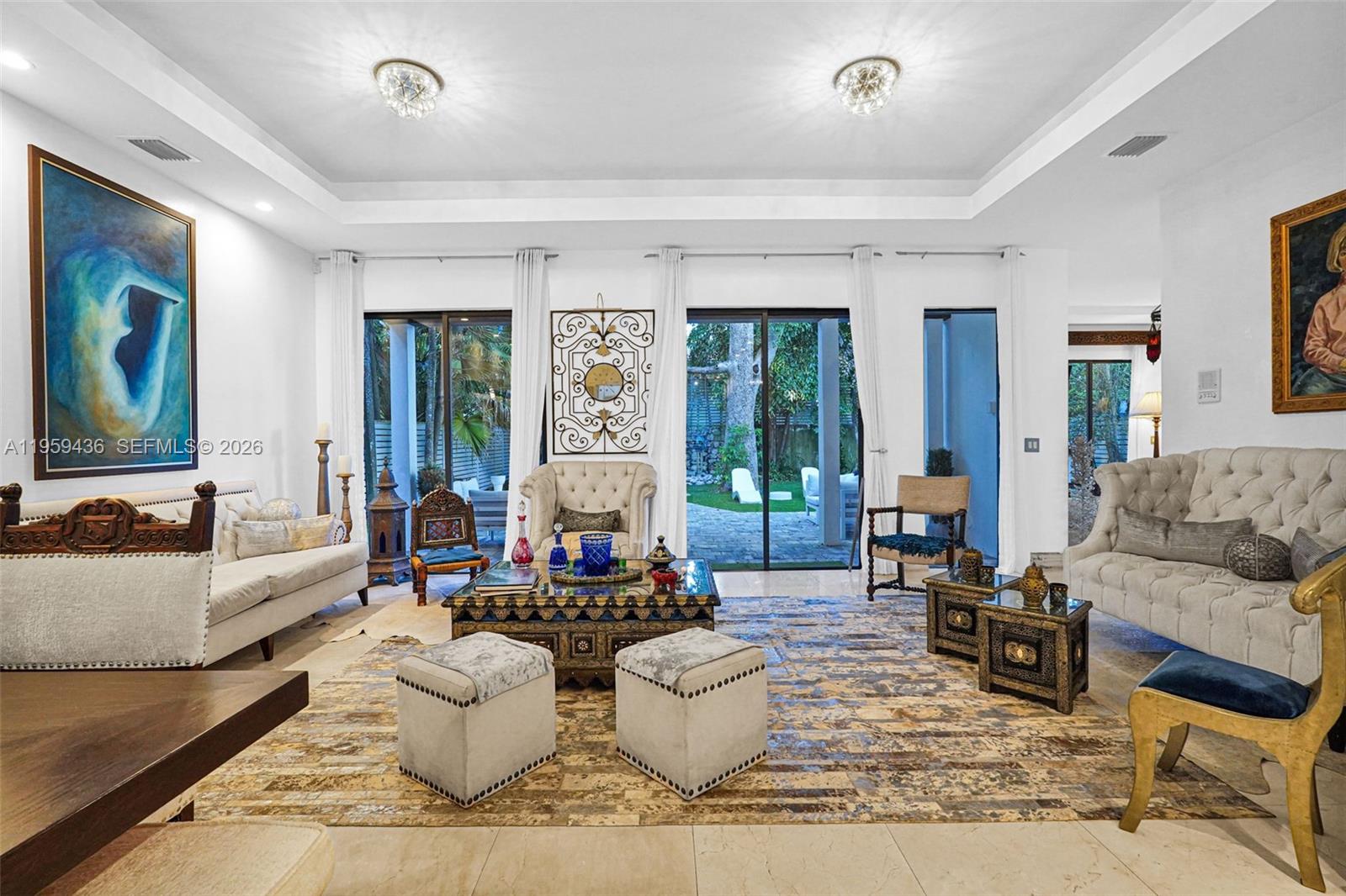 3675 Loquat Avenue Miami, FL 33133 - Photo 36 of 65 a living room with furniture and a large window
