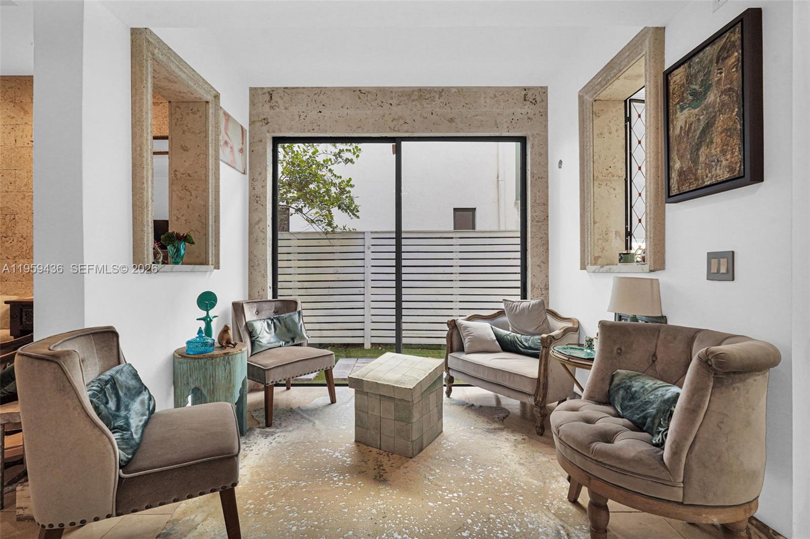 3675 Loquat Avenue Miami, FL 33133 - Photo 37 of 65 a living room with furniture and a window