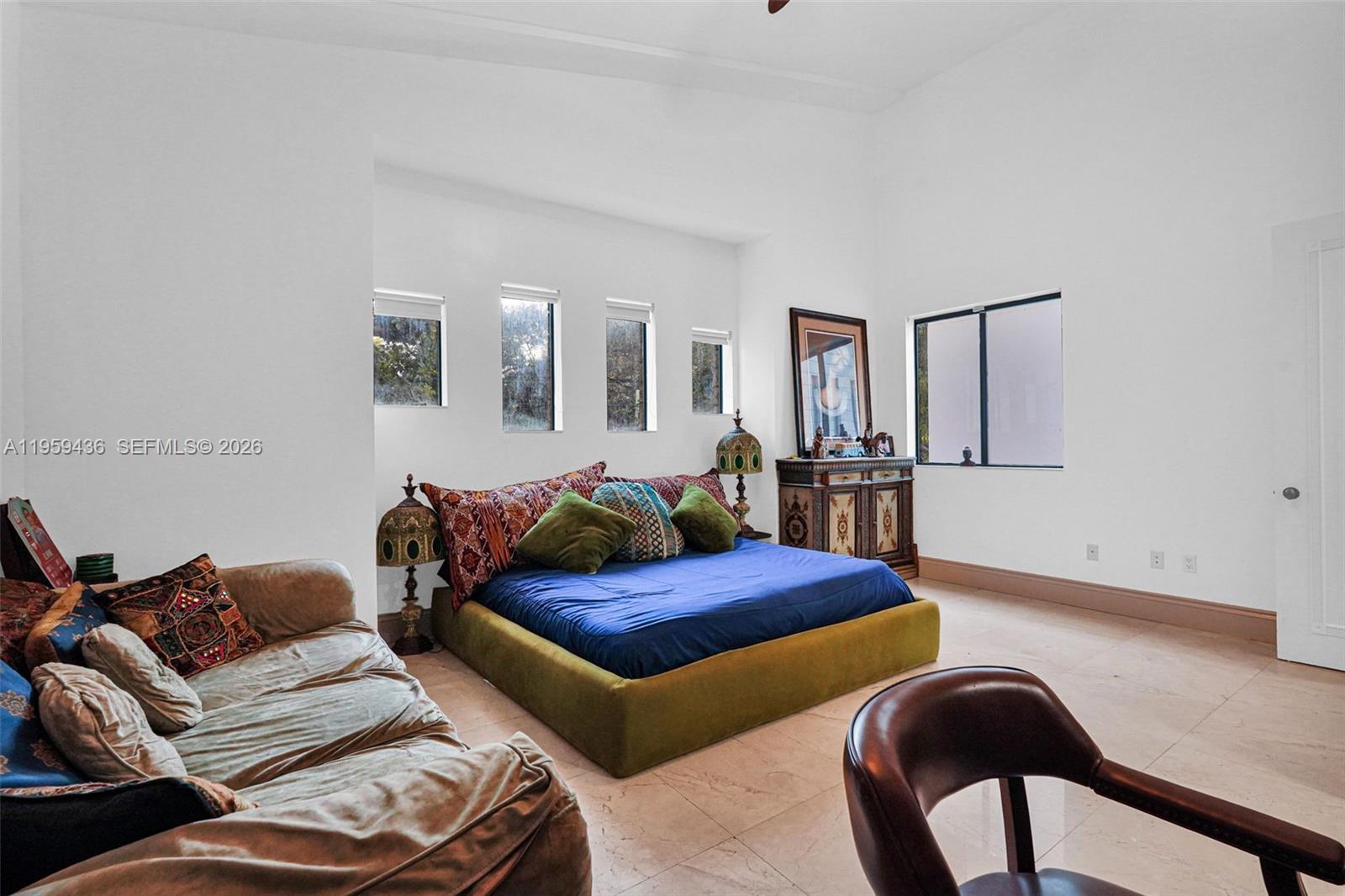 3675 Loquat Avenue Miami, FL 33133 - Photo 54 of 65 a bedroom with furniture and wooden floor