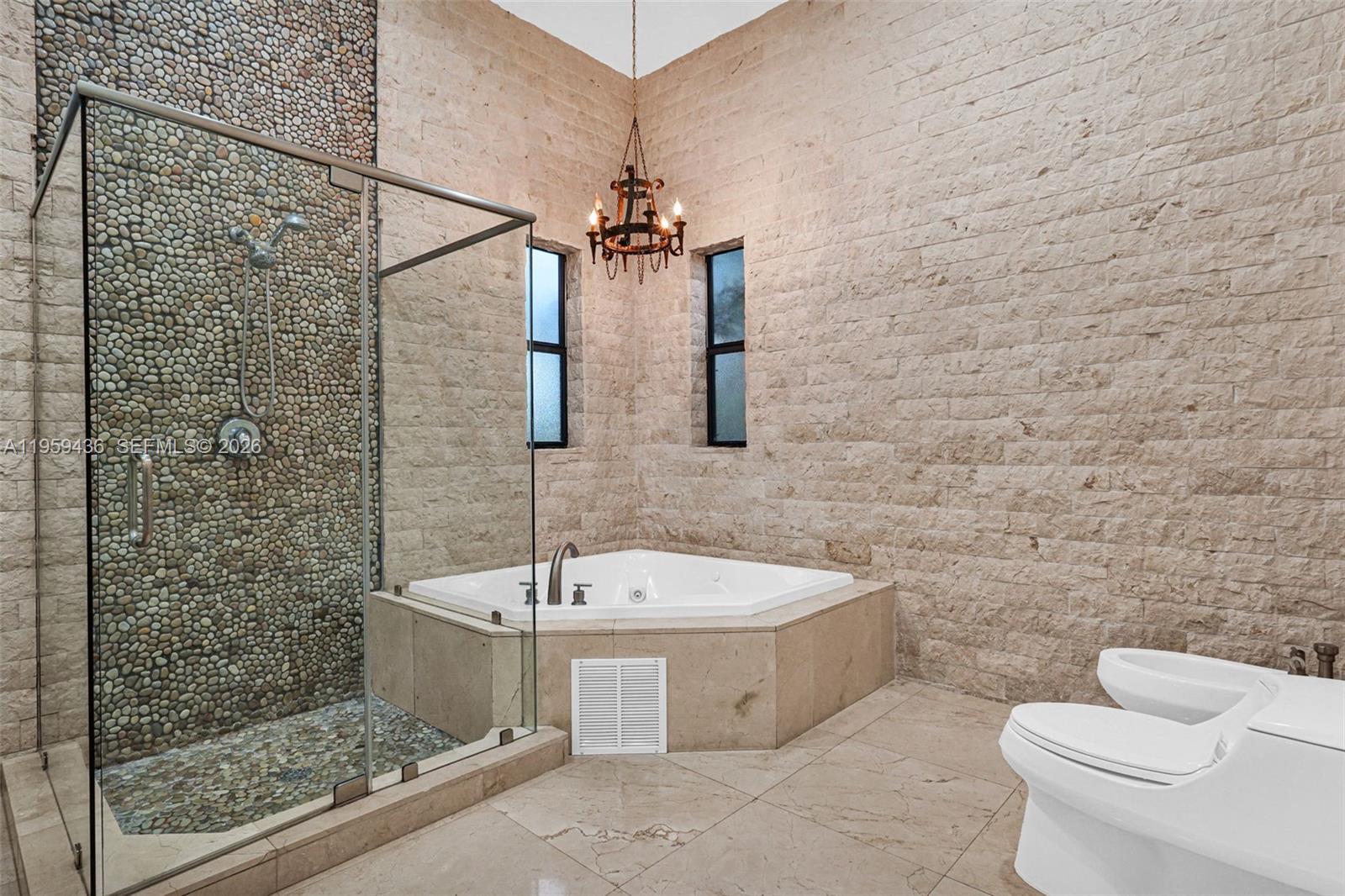 3675 Loquat Avenue Miami, FL 33133 - Photo 62 of 65 a bathroom with a sink a toilet and shower