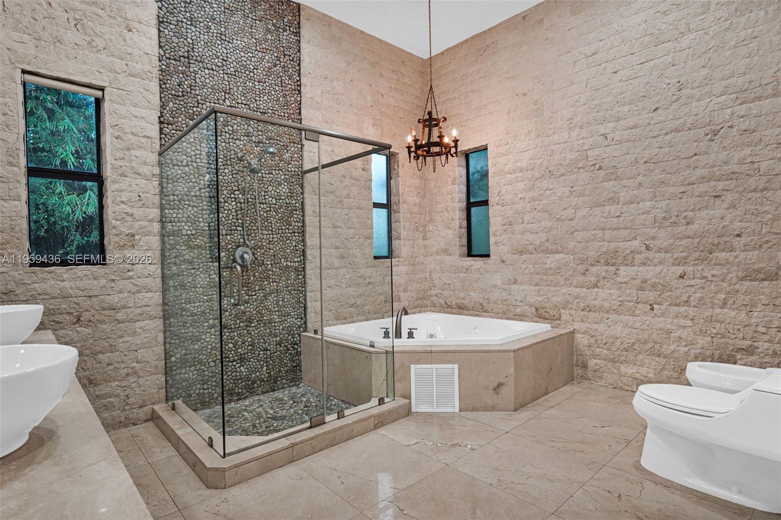 3675 Loquat Avenue Miami, FL 33133 - Photo 63 of 65 a bathroom with a sink a toilet and shower
