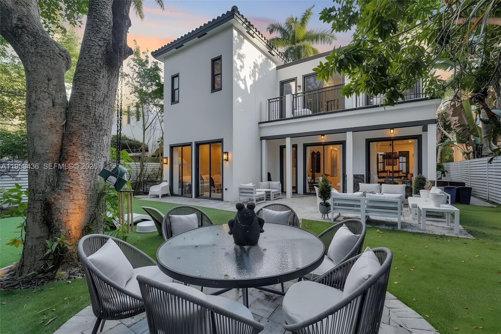3675 Loquat Avenue Miami, FL 33133 - Photo 9 of 65 a view of a house with backyard and sitting area