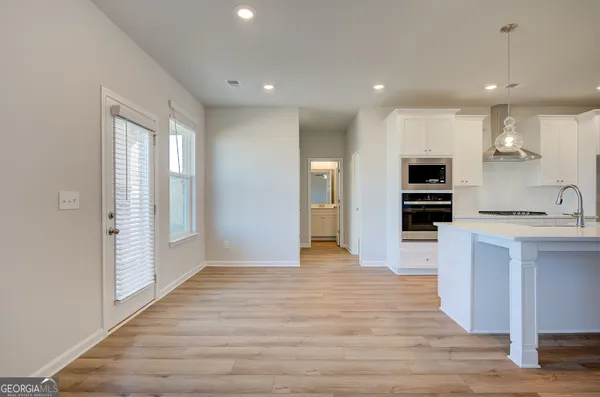 a view of kitchen with cabinets and stainless steel appliances