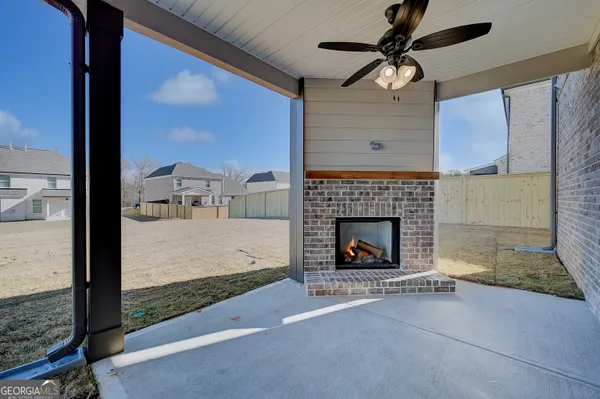 a living room with a fireplace furniture and a fireplace