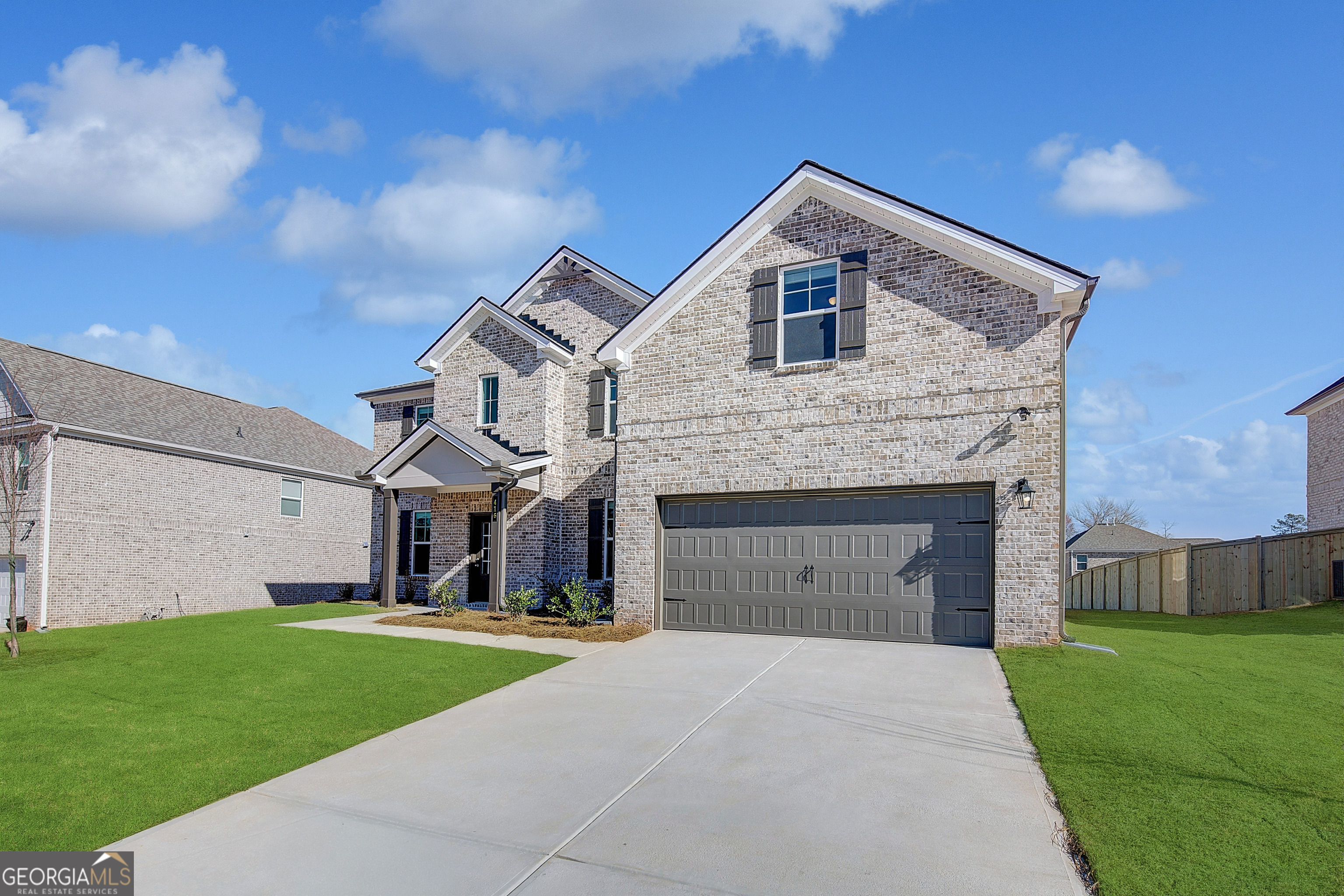 416 Hatcher Court Hampton, GA 30228 - Photo 2 of 30 a front view of a house with a garden and yard