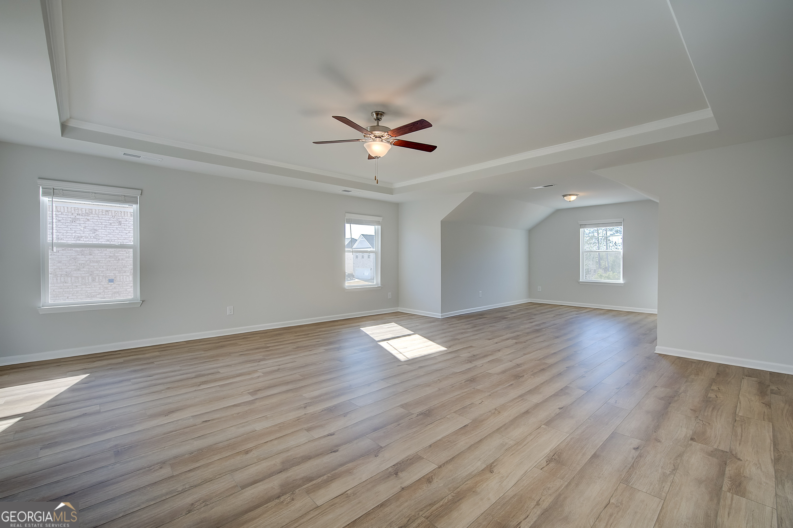 416 Hatcher Court Hampton, GA 30228 - Photo 22 of 30 an empty room with wooden floor and windows