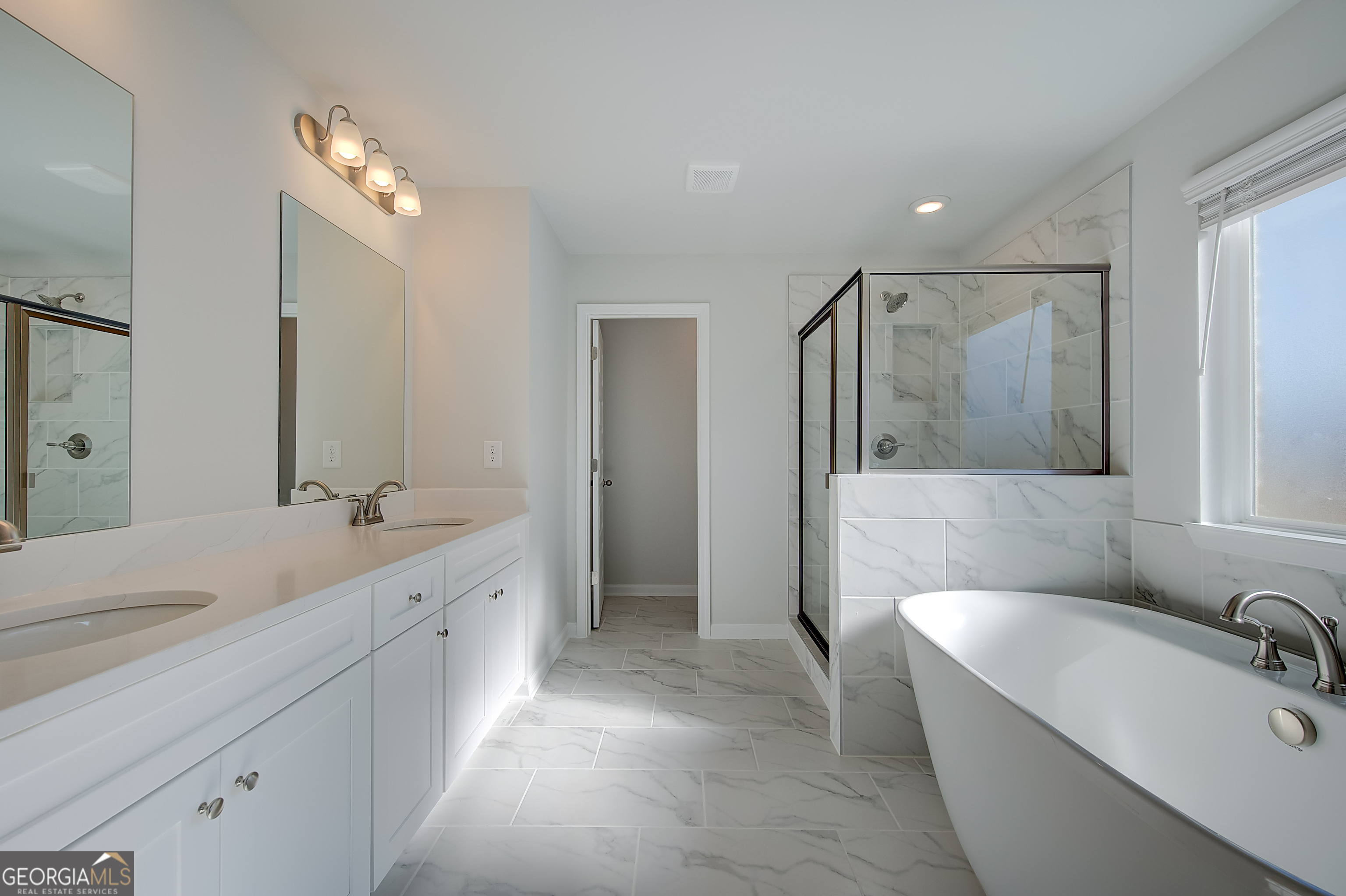 416 Hatcher Court Hampton, GA 30228 - Photo 25 of 30 a spacious bathroom with a double vanity sink mirror and bathtub