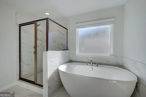 a view of a house with a yard and garage