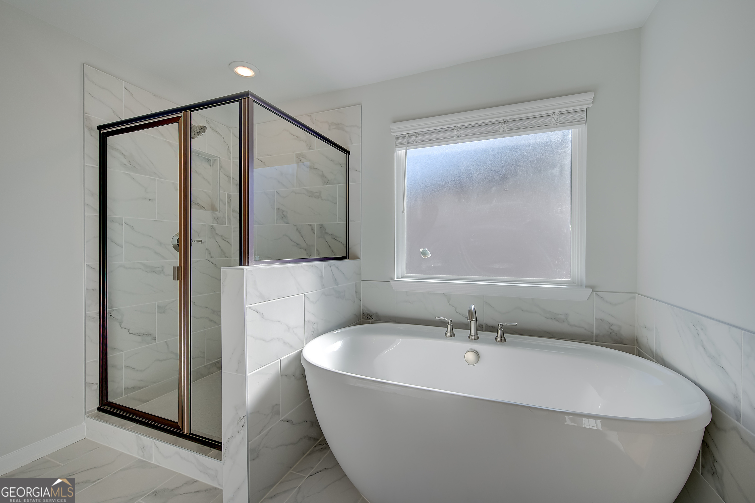 416 Hatcher Court Hampton, GA 30228 - Photo 27 of 30 a white bath tub sitting next to a shower