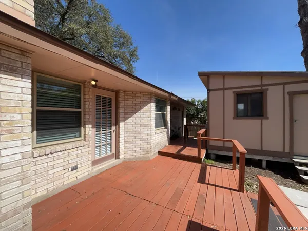 a view of a deck with wooden floor and outdoor seating