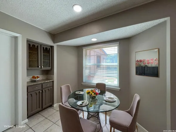 a dining room with furniture and window