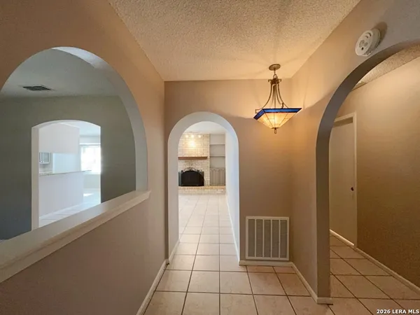 a view of a hallway with windows