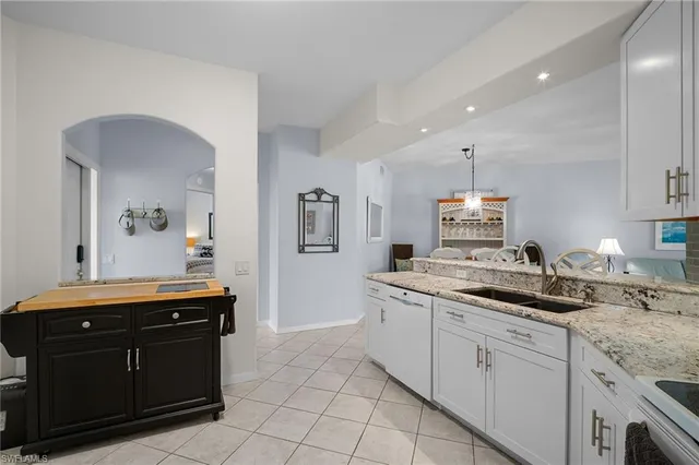 a kitchen with a sink and cabinets