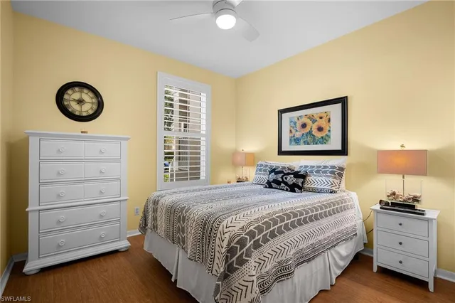 a bedroom with a bed and a chair