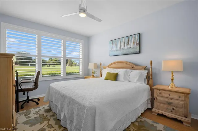 a bedroom with a bed and a flat tv screen