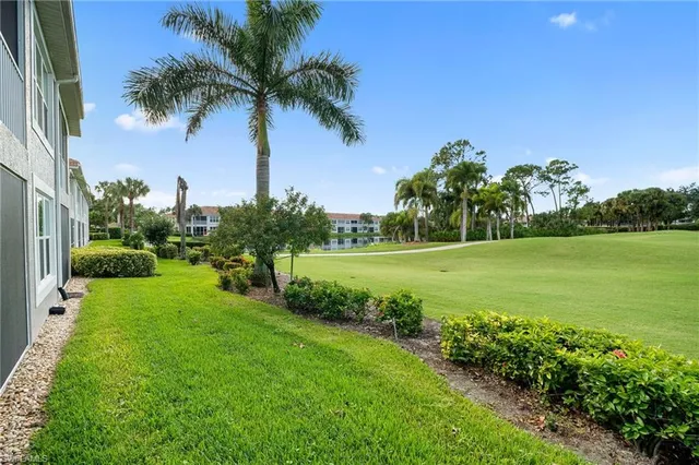 a view of a lake with a big yard