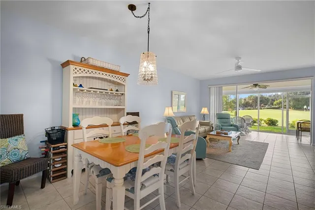 a very nice looking dining room with a large window