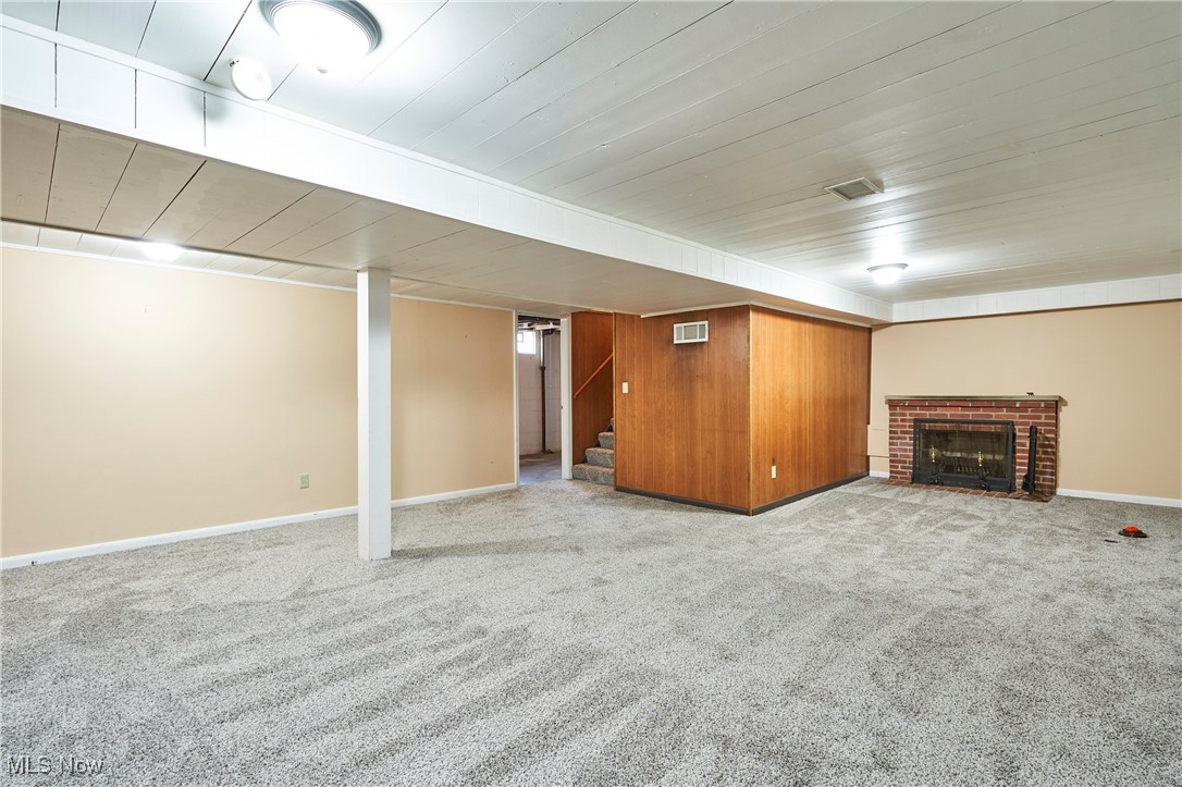 206 Benson Road Akron, OH 44333 - Photo 19 of 27 Finished rec with new carpet and fireplace