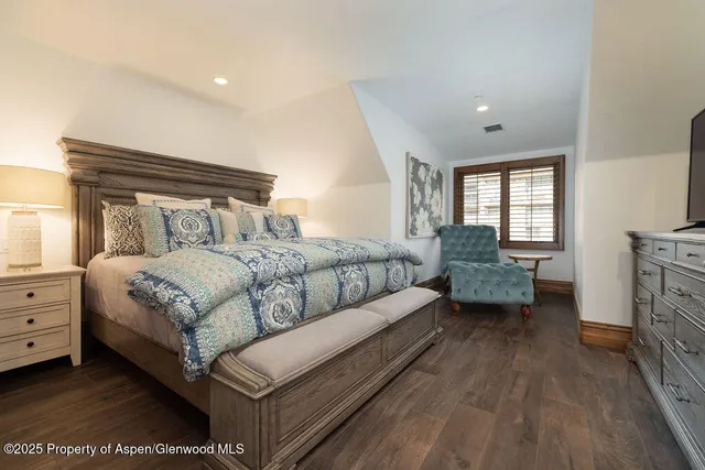 a bed room with a bed and a couch