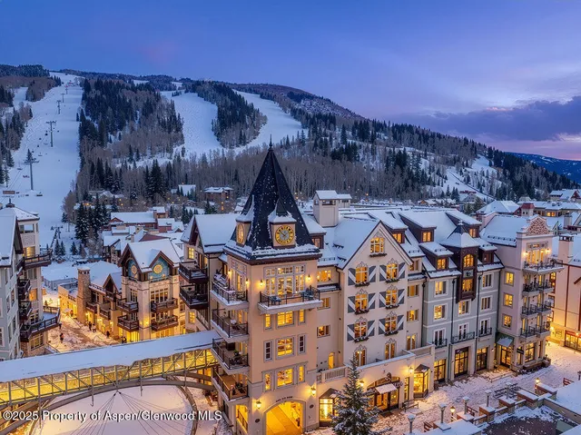 a view of multiple houses with a street