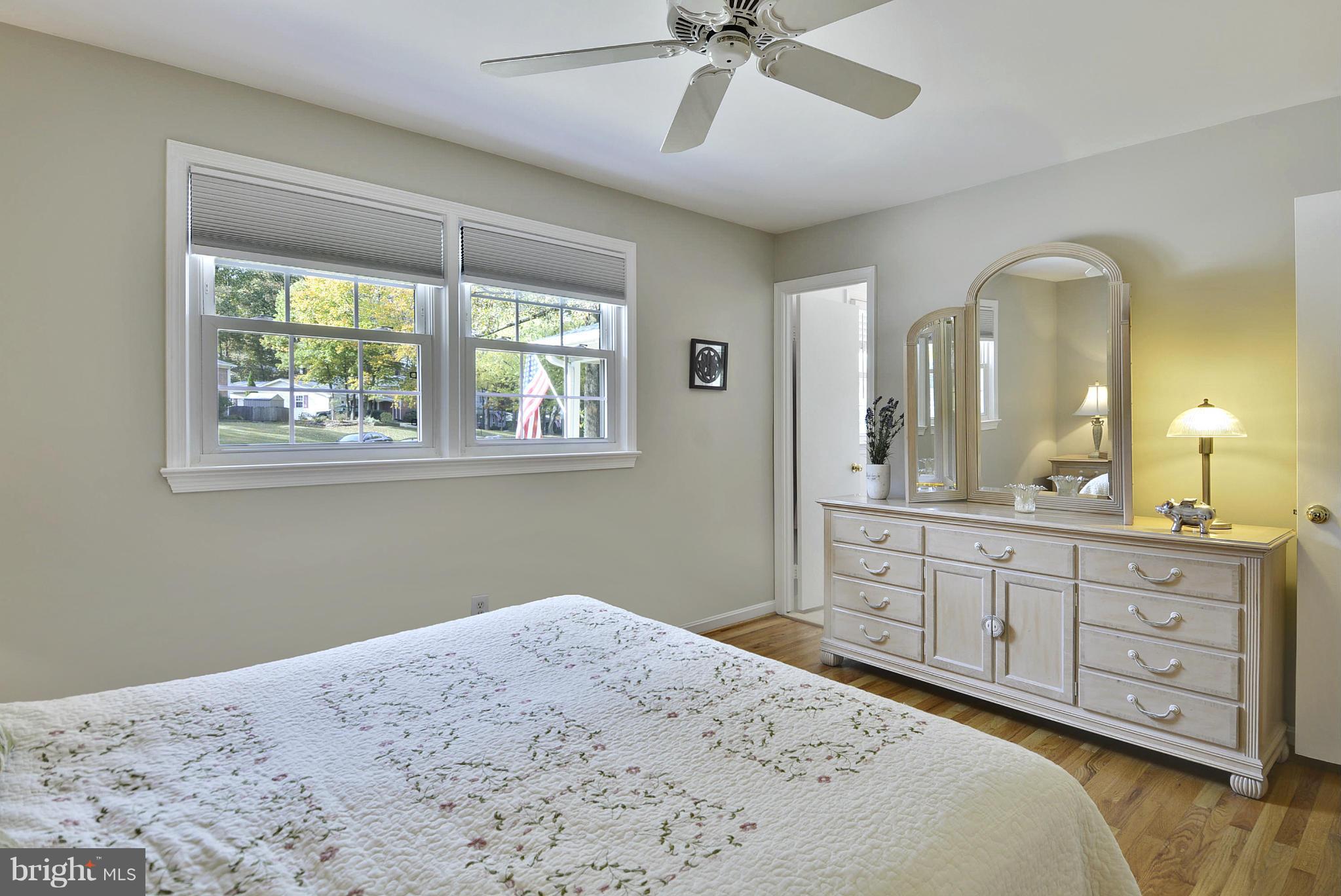 6731 Houndmaster Road Springfield, VA 22152 - Photo 11 of 30 a bedroom with a bed and a dresser